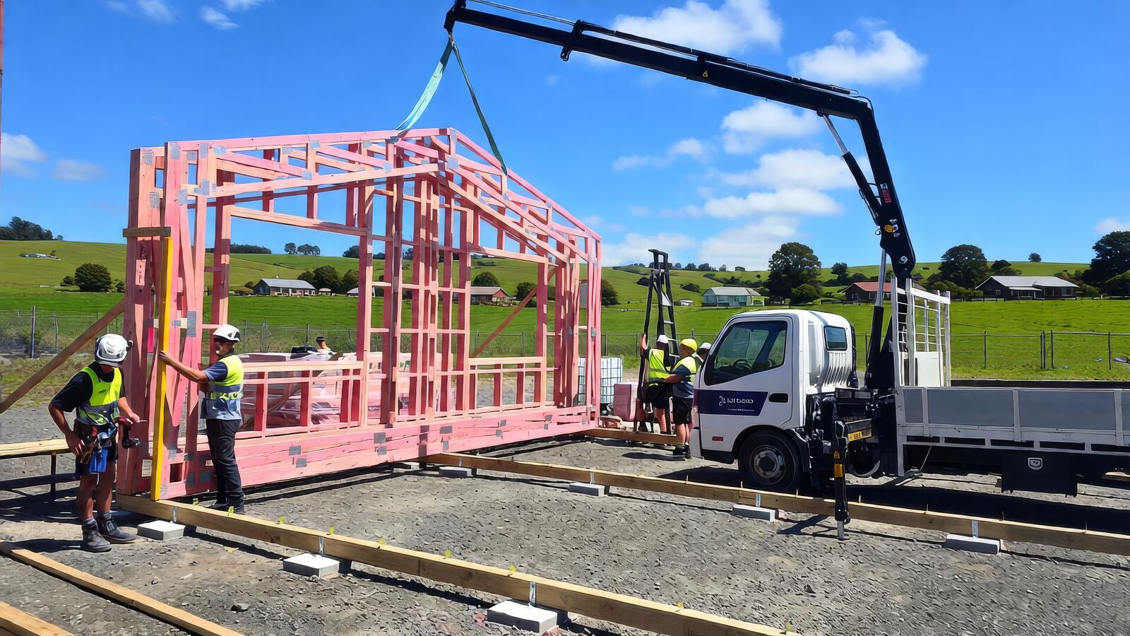 Wall panel being craned onto site